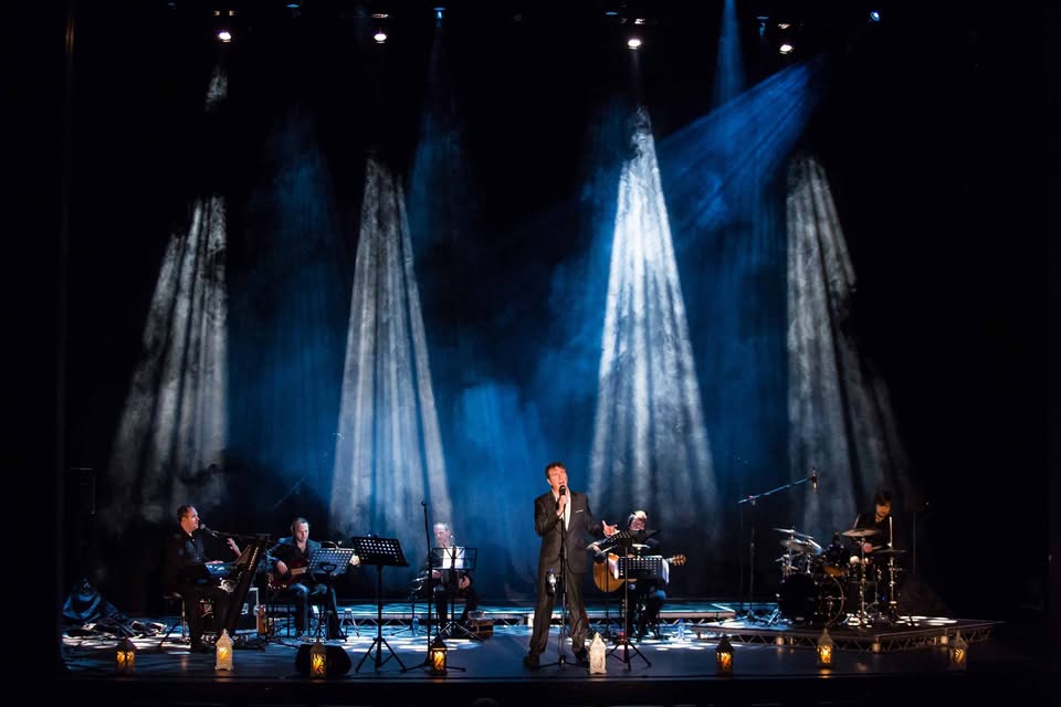 Liam Lawton performing in concert with his band